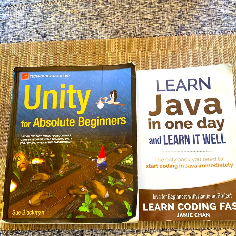 2 computer programming books- Unity and Java